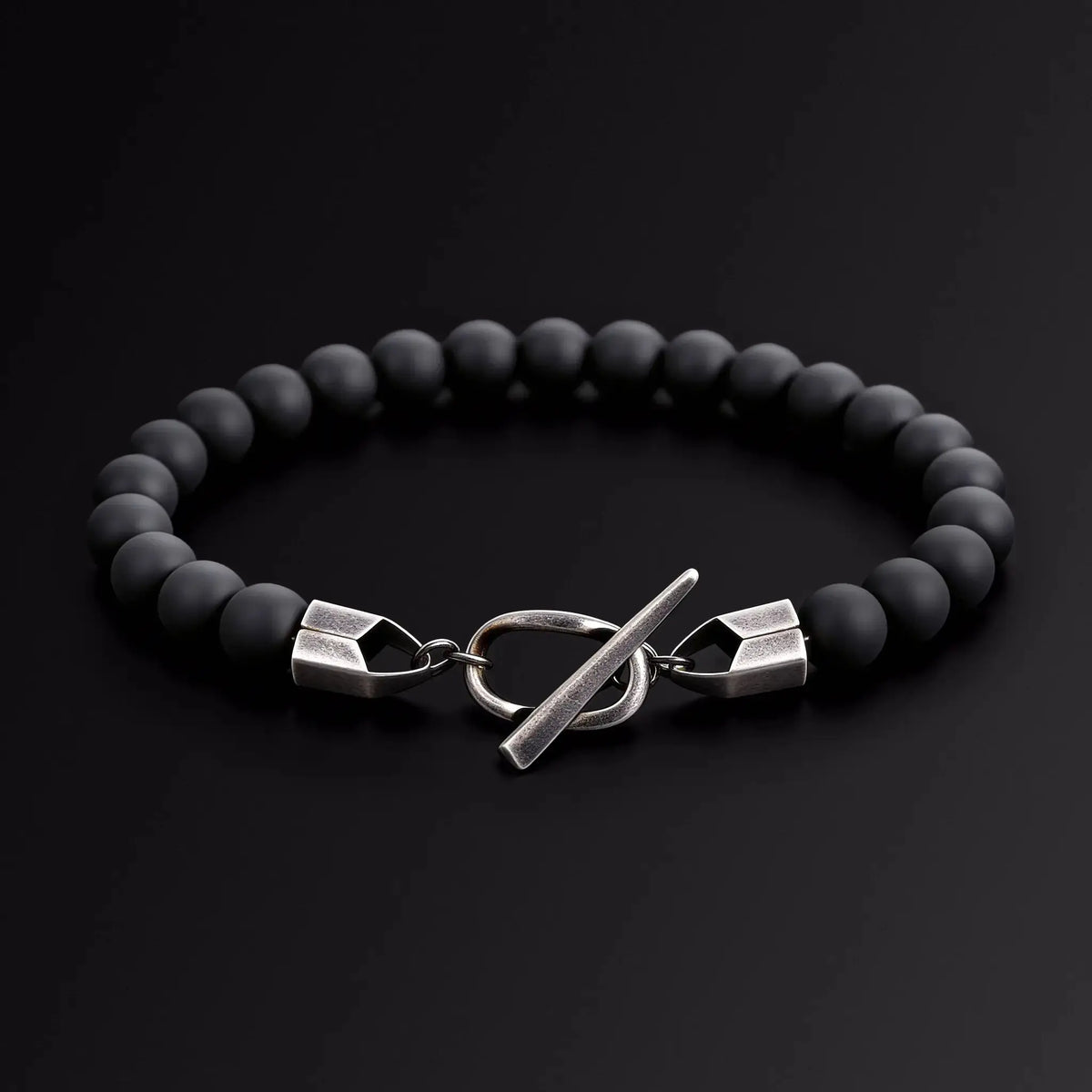Black beaded bracelet with silver Japanese Melody