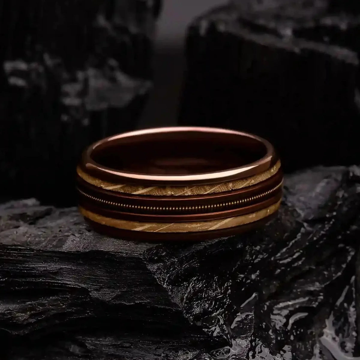 Close-up of the Whiskey Barrel Ring featuring a sleek tungsten finish, wood inlay, and guitar string detail, perfect for daily wear or weddings