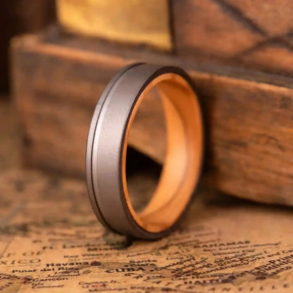 Handcrafted ring made of Oak Wood and Titanium. The ring has a width 4 mm
